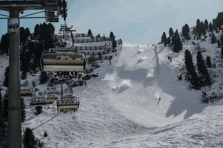 Snowy ski slope with chairlift in Tyrol, Austria, ideal for winter sports.