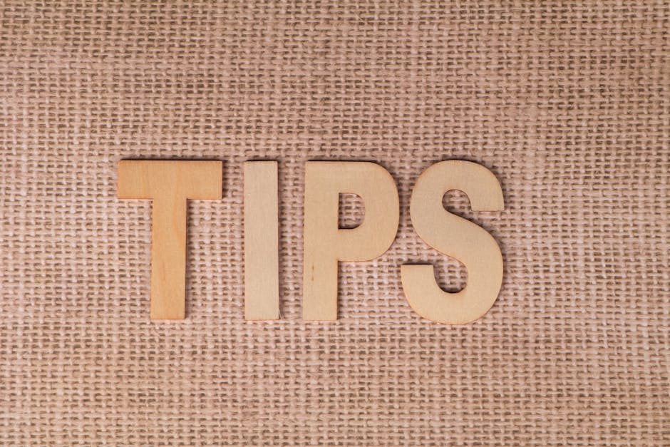 The word 'TIPS' in wooden letters on a burlap background, ideal for business advice visuals.