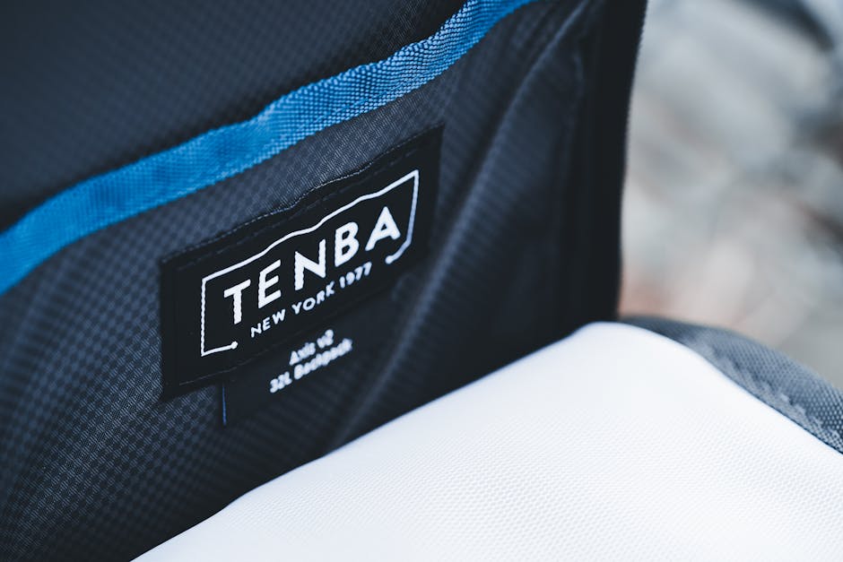Detailed view of a Tenba bag label and inner pocket, emphasizing the brand logo.